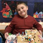 student making a gingerbread house