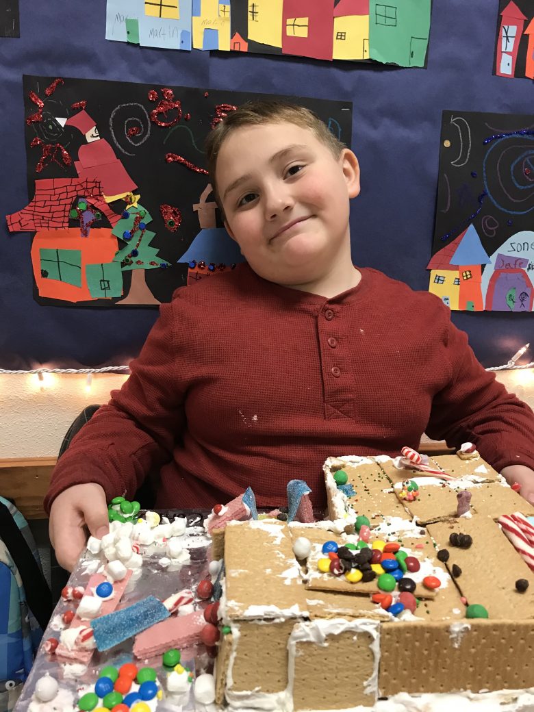 student making a gingerbread house